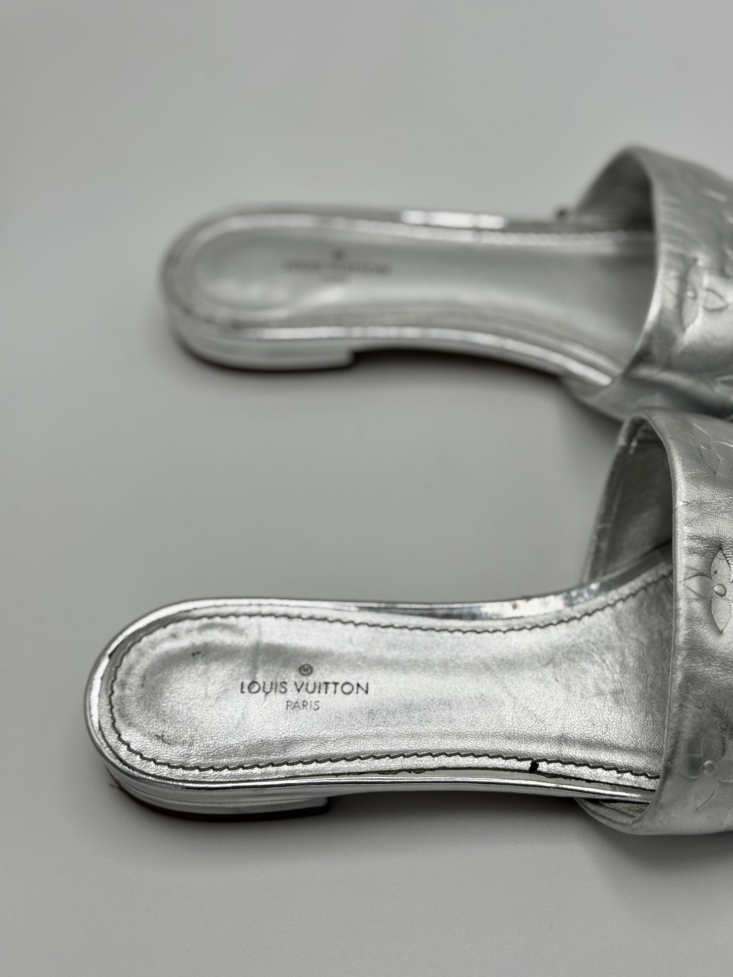 Louis Vuitton Silver Monogram Embossed Leather Revival Flat Slides 37.5