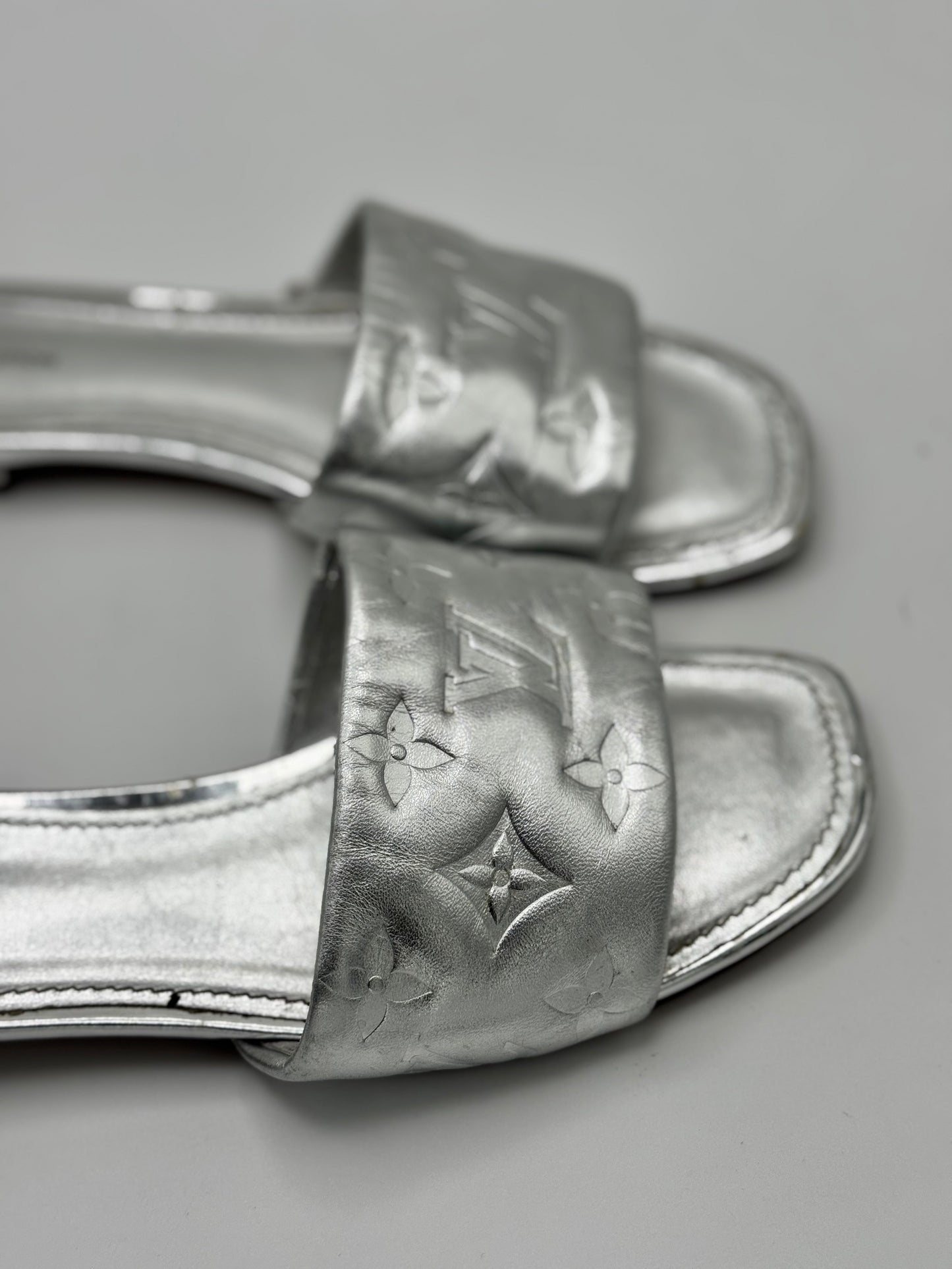 Louis Vuitton Silver Monogram Embossed Leather Revival Flat Slides 37.5